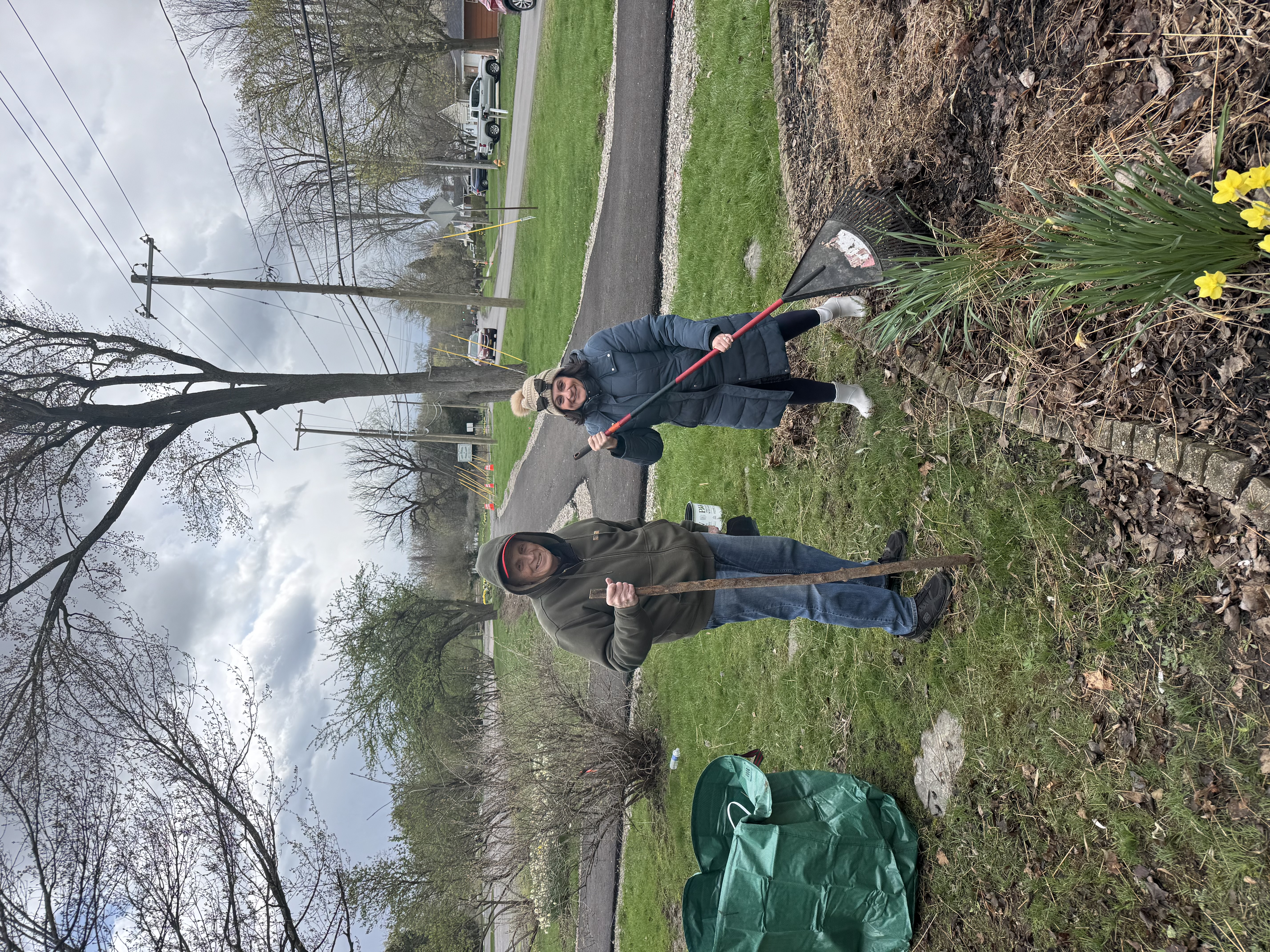 Volunteers cleaning and raking Ryan's Garden