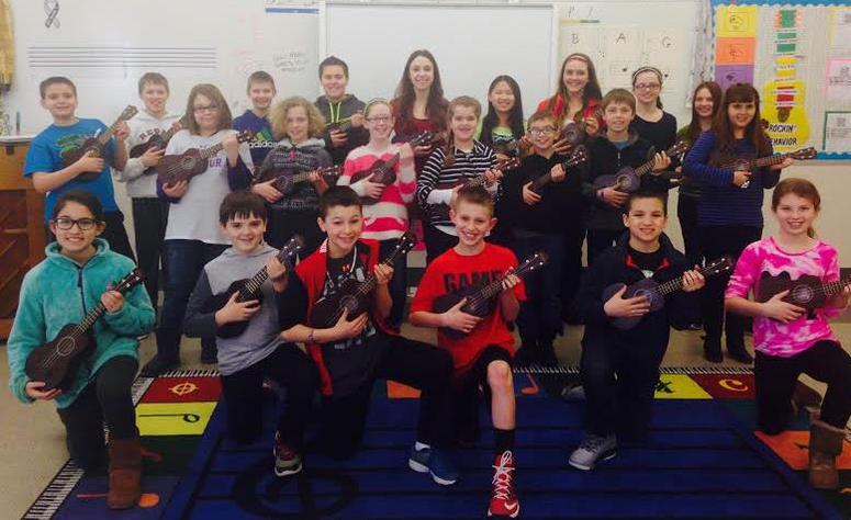 Students at Meadow School with ukuleles